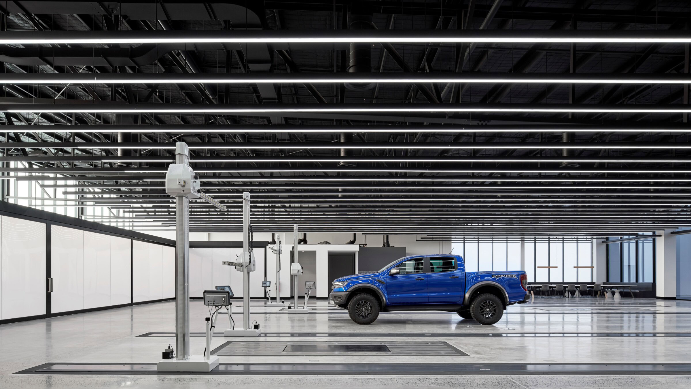 Side view of vehicle prototyping bay at Ford Design Centre by Genton in Sydney — precision-designed with spatial control, supporting data centre architect Sydney capabilities.