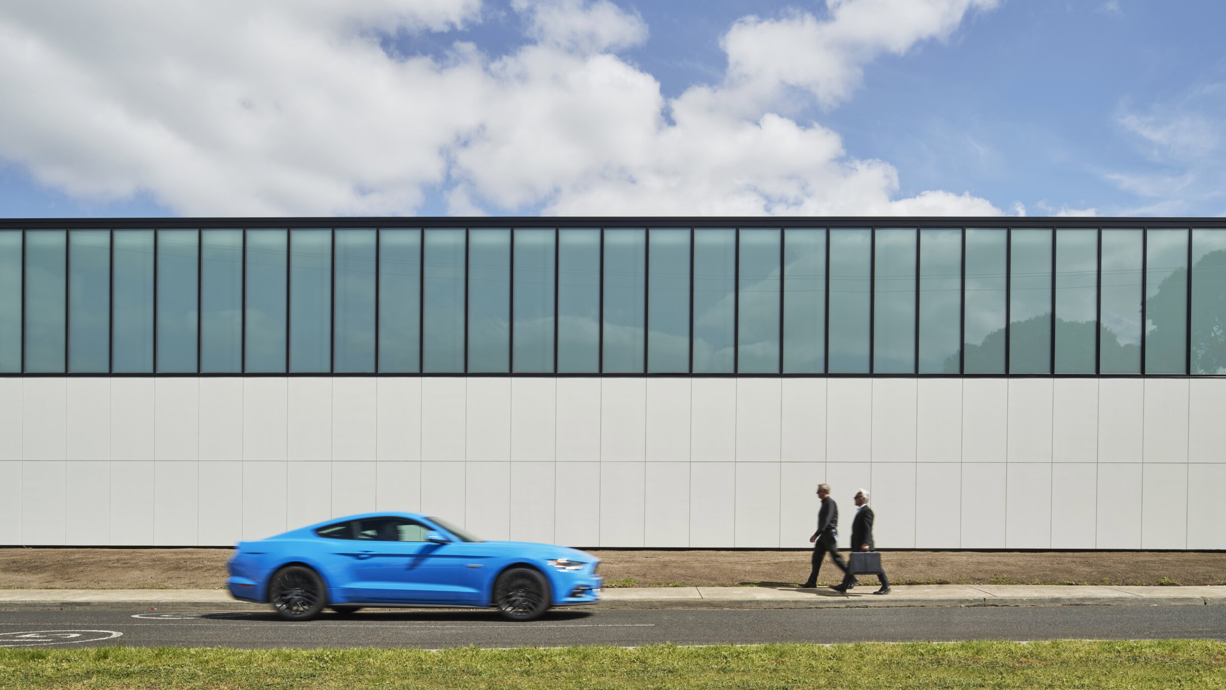 Exterior of Ford Design Centre in Sydney by Genton, featuring translucent glazing and clean lines — reflecting expertise in secure, minimal design for data centre architects in Sydney and Melbourne.