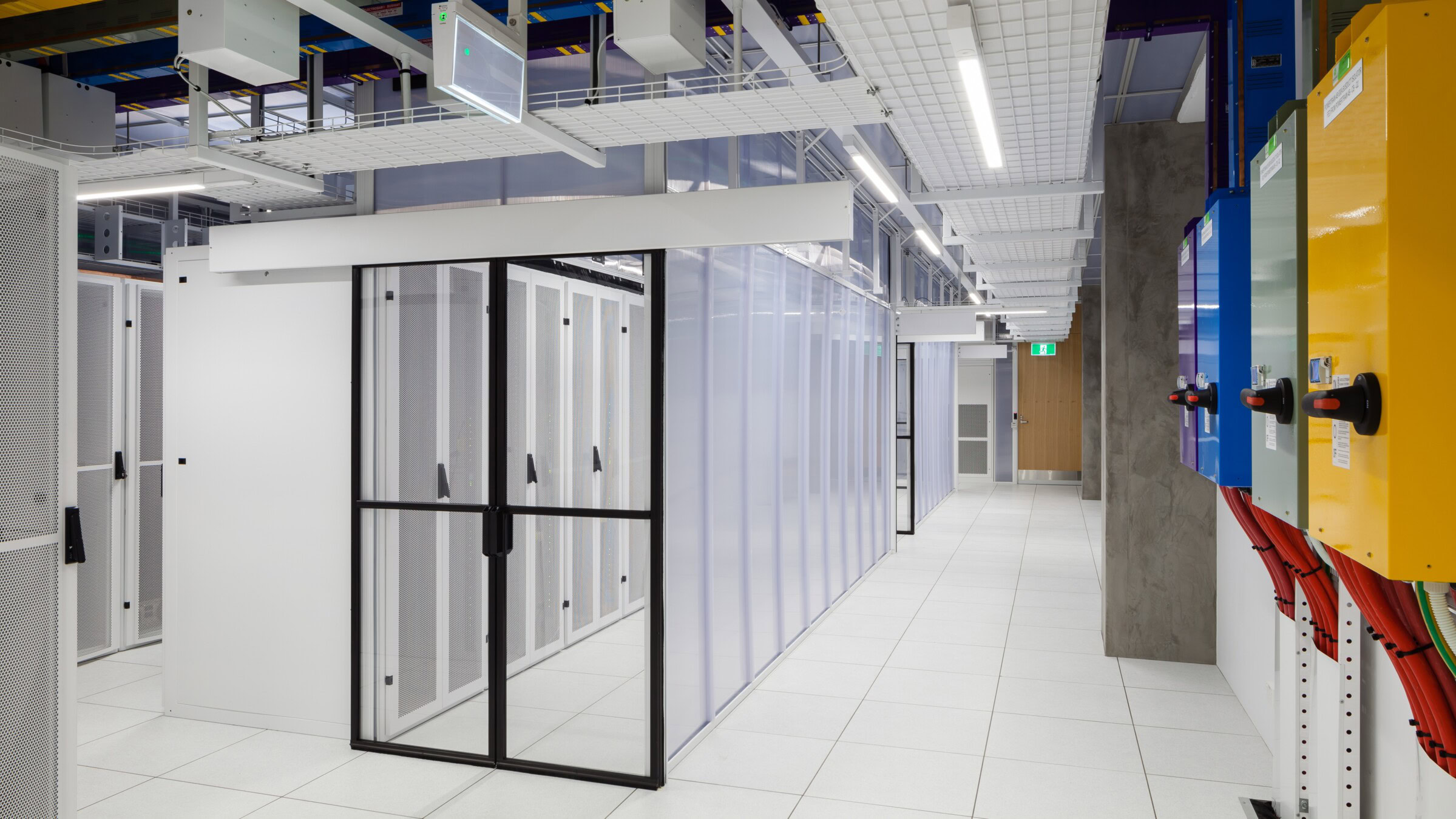 Data centre architect Sydney – secure server room with glass partitions and technical systems by Genton